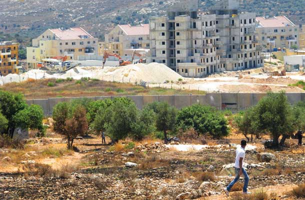 Gradnja ene izmed mnogih judovskih naselbin na palestinski zemlji