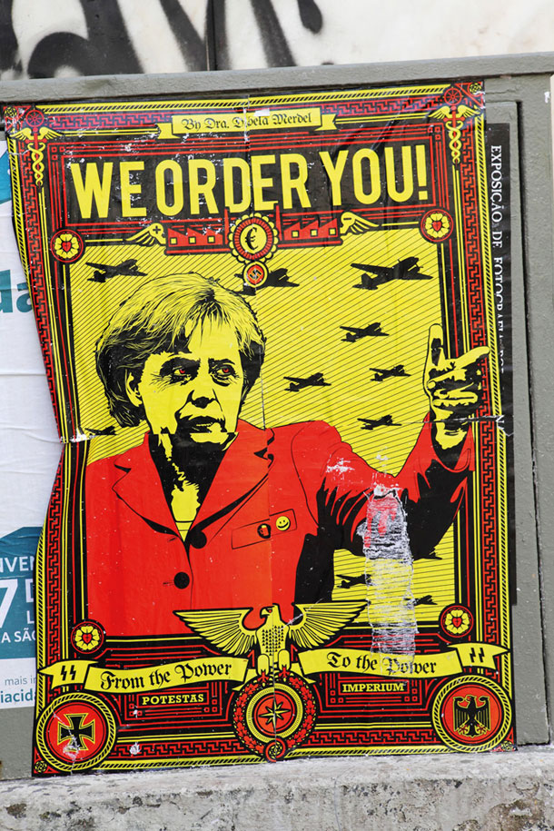 Plakat na protestu proti Angeli Merkel v Lizboni