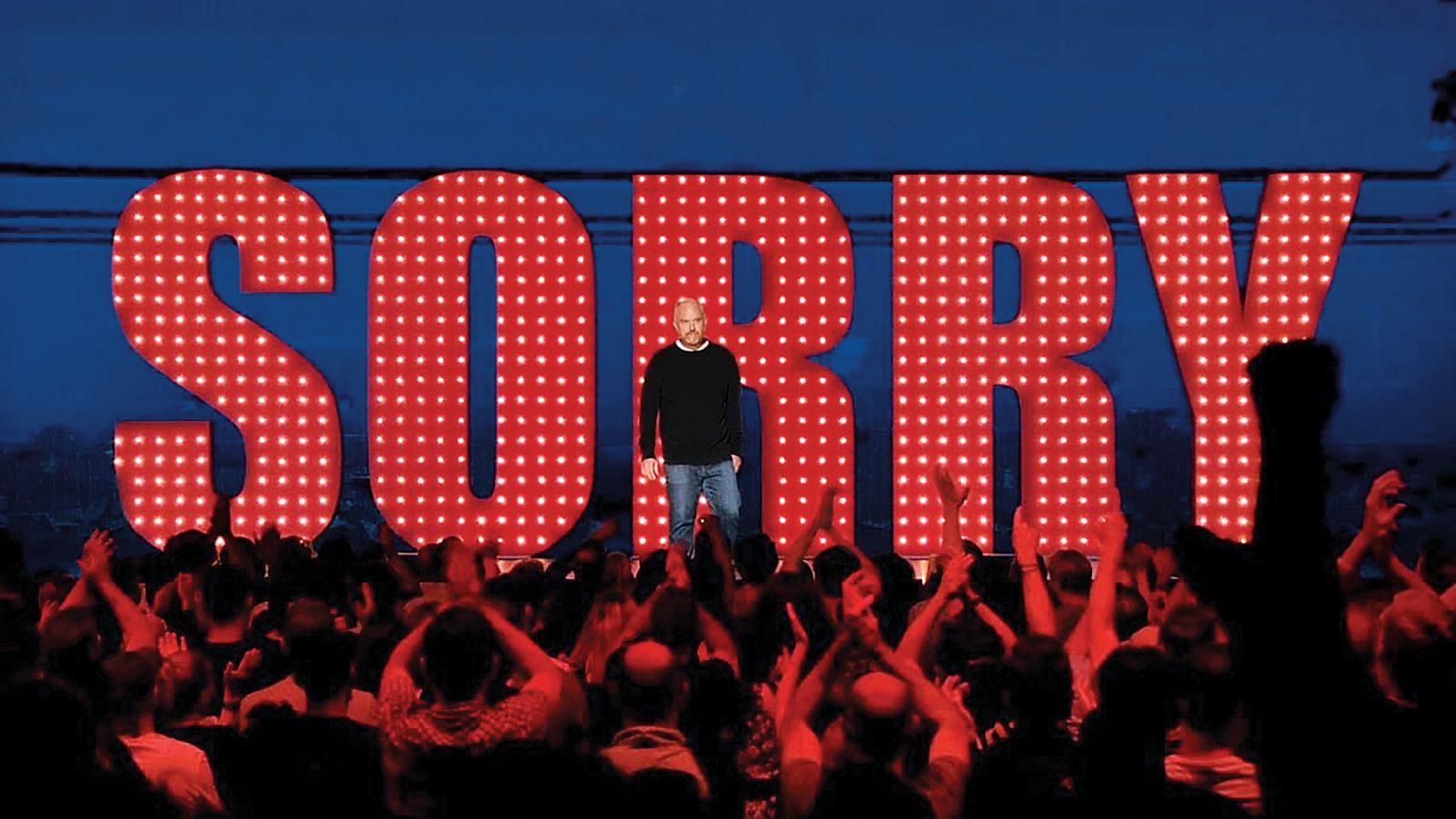 Stand-up Sorry (Oprostite), s katerim se je Louis CK vrnil, potem ko je bil skenslan.