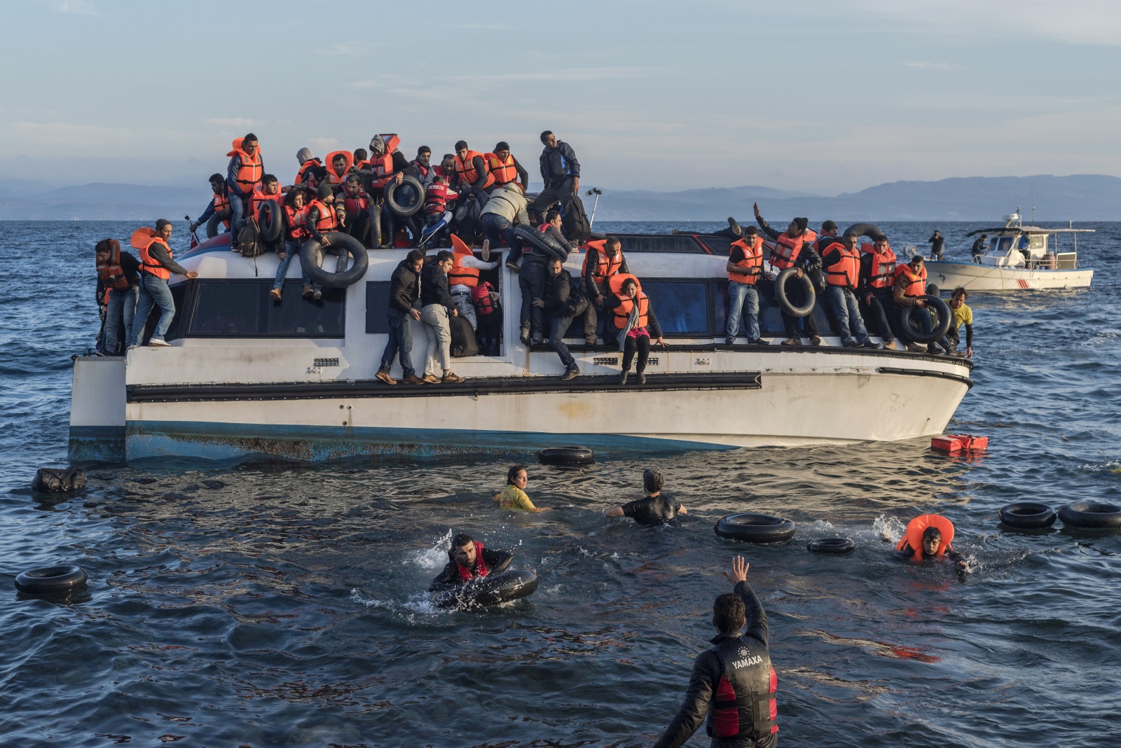 Sirski in iraški migranti, ki so se na poti iz Turčije pred meseci izkrcavali na grškem otoku Lezbos.